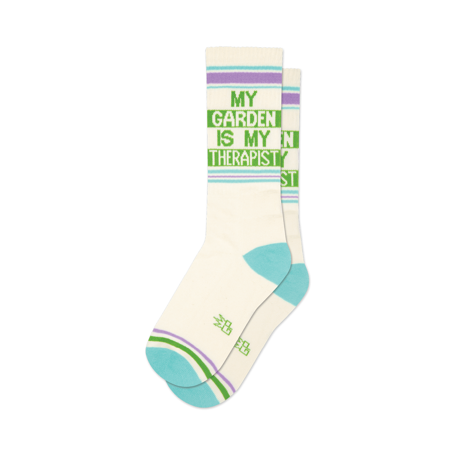 Pair of off-white crew socks with a green 'My Garden Is My Therapist' design and light purple and teal stripes.