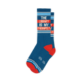 Pair of teal crew socks with orange and white stripes. Text reads: 'The Library Is My Therapist'.