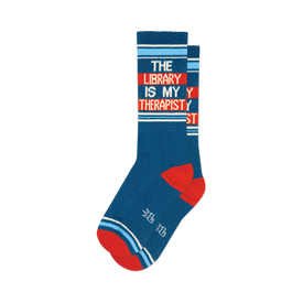 front view of a pair of blue socks with red and white stripes that say "the library is my therapist".