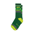 Pair of dark green crew socks with lime green and purple stripes and the text 'Weed Is My Therapist'.