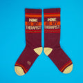 Another view of the socks on a blue background, showcasing the design. [lf]