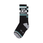 Pair of black crew socks with teal and white stripes and the text 'Yoga Is My Therapist'.
