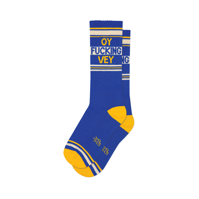Pair of blue crew socks with yellow and white stripes and the phrase 'OY FUCKING VEY' in yellow lettering.