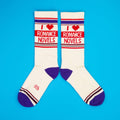 Another flatlay of 'I Heart Romance Novels' socks, on a blue background; this time, socks are laid out differently.