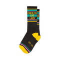 Pair of black crew socks with yellow, teal, and pink stripes.  'Childless Cat Lady' is written in yellow.