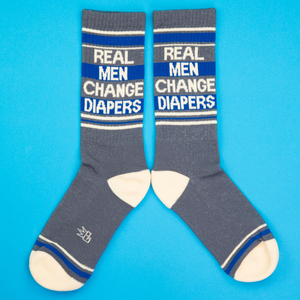 Another flat lay product shot of the socks, arranged differently against a blue backdrop.