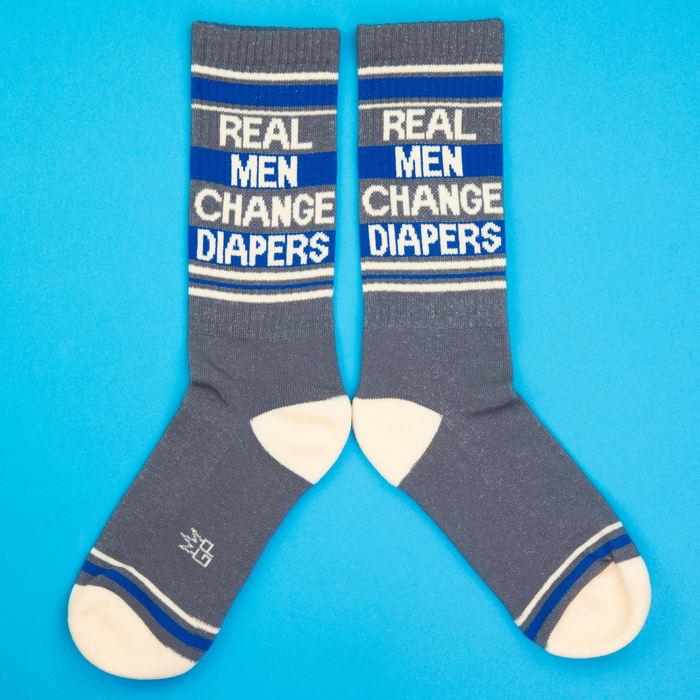 Another flat lay product shot of the socks, arranged differently against a blue backdrop.
