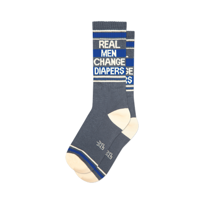 Pair of grey crew socks with blue stripes and the text 'Real Men Change Diapers'.