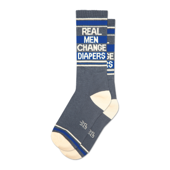 Pair of grey crew socks with blue stripes and the text 'Real Men Change Diapers'.