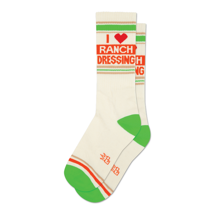 Pair of cream-colored crew socks with green and orange stripes and an 'I Heart Ranch Dressing' graphic. 
