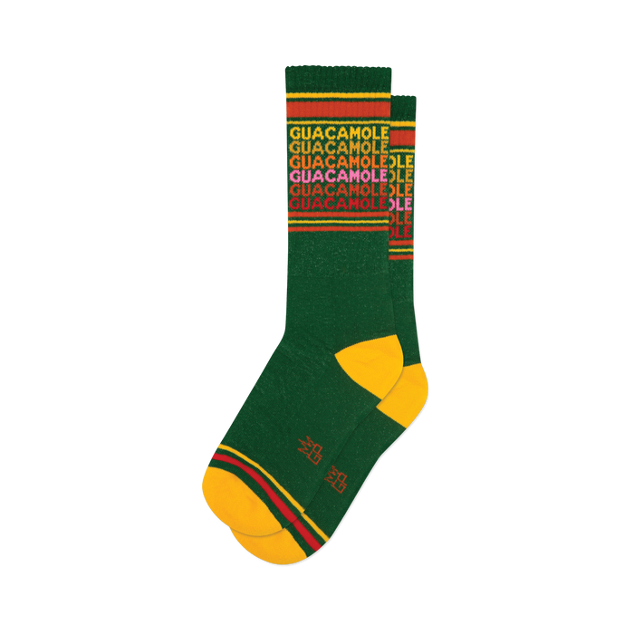 Pair of green crew socks with a repeating 'Guacamole' pattern in yellow, red, and pink. Yellow and red stripes at the top and bottom.
