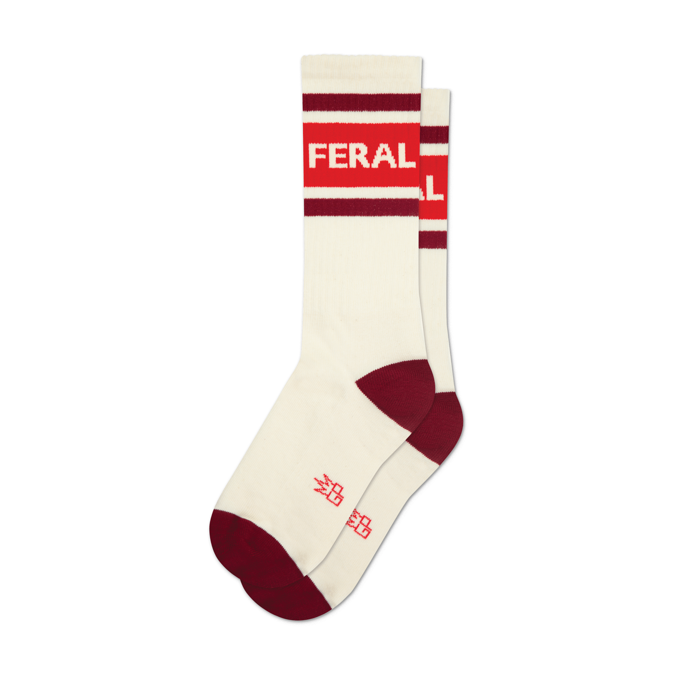 Pair of cream-colored crew socks with red and burgundy stripes and the word 'FERAL' in bold white lettering.