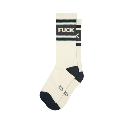 Pair of cream-colored crew socks with bold black stripes and the word 'F*CK' printed across the stripes.