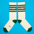 Another pair of 'Horny' socks, displayed flat against a bright blue background.