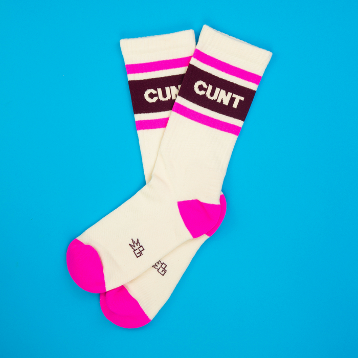 Lifestyle shot of the socks lying on a blue background.