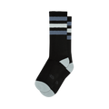 Pair of black crew socks with grey and white stripes.  Features a light grey toe and heel, and a small logo on the sole.