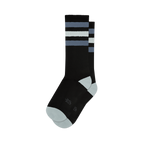 Pair of black crew socks with grey and white stripes.  Features a light grey toe and heel, and a small logo on the sole.