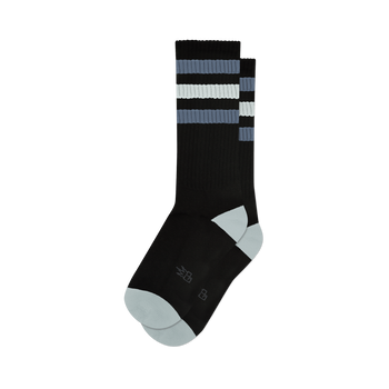 Pair of black crew socks with grey and white stripes.  Features a light grey toe and heel, and a small logo on the sole.