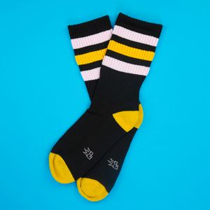 Flatlay of Jane Retro socks on a bright blue background.