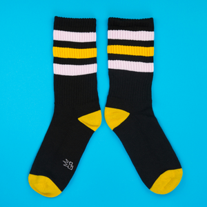 Another flatlay showcasing the Jane Retro socks, this time arranged in a slightly different way on a blue background.