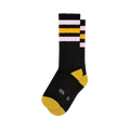 Pair of black crew socks with pink and gold retro stripes. Yellow heel and toe. 
