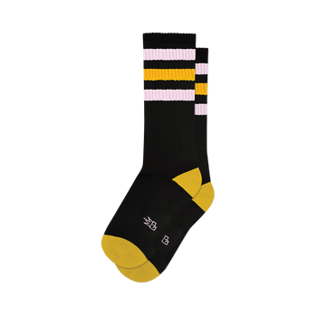 Pair of black crew socks with pink and gold retro stripes. Yellow heel and toe. 