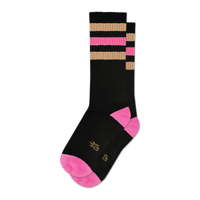 Pair of black crew socks with pink and beige retro stripes.  Pink accents at the heel and toe. Small logo on the sole.