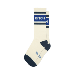 Cream athletic crew socks with navy blue toe/heel and stripes. Bold blue stripe features 