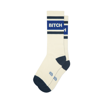 Cream athletic crew socks with navy blue toe/heel and stripes. Bold blue stripe features "BITCH" in white lettering.