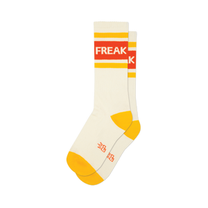 Pair of cream crew socks with orange and yellow stripes and the word 'FREAK' displayed.  A fun, retro design.