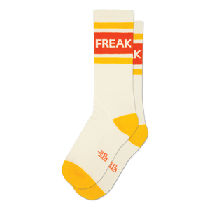 Pair of cream crew socks with orange and yellow stripes and the word 'FREAK' displayed.  A fun, retro design.
