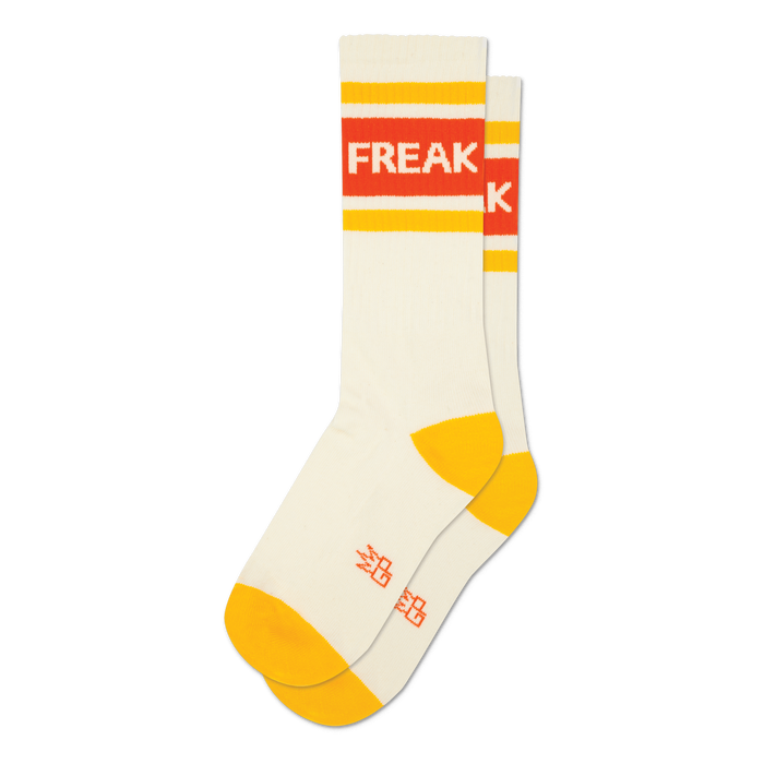 Pair of cream crew socks with orange and yellow stripes and the word 'FREAK' displayed.  A fun, retro design.