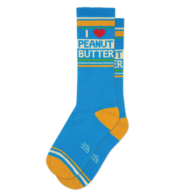 Pair of bright blue crew socks with 'I Heart Peanut Butter' in white text, red heart, yellow toes/heels, and yellow/white stripes.