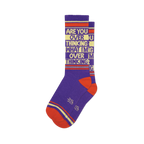Pair of purple crew socks with orange and beige stripes and the text 'ARE YOU OVER THINKING WHAT I'M OVER THINKING' repeated.