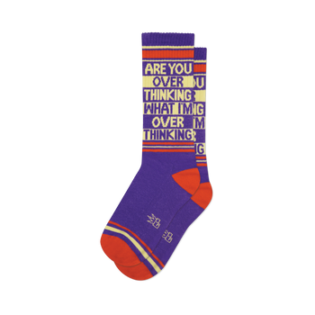 Pair of purple crew socks with orange and beige stripes and the text 'ARE YOU OVER THINKING WHAT I'M OVER THINKING' repeated.