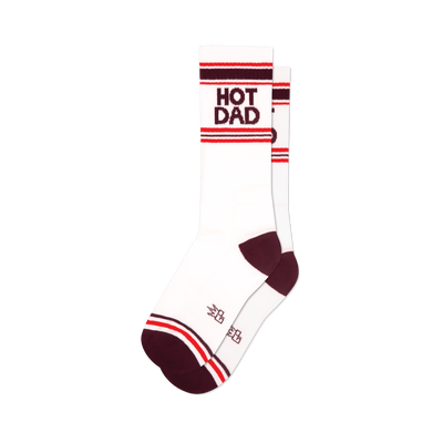 Pair of white crew socks with maroon and red stripes and 'HOT DAD' text.  Retro style.