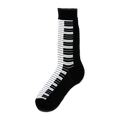 Black crew socks featuring a striking white and black piano key design running down the side. 