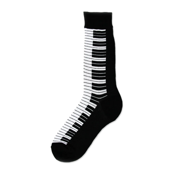 Black crew socks featuring a striking white and black piano key design running down the side. 