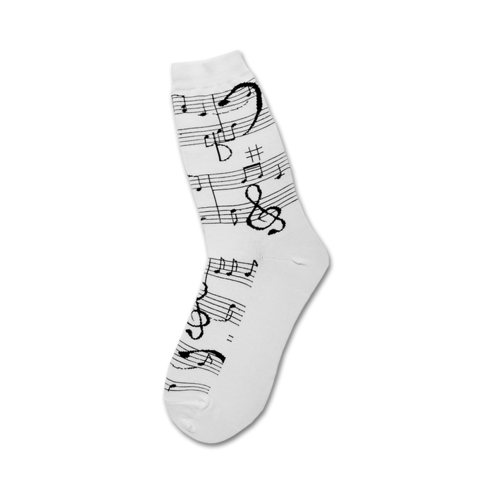 black treble clef and music notes on white background adorn these women's crew socks, perfect for the music lover.  