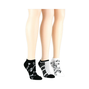 Lifestyle shot: three pairs of musical socks on mannequin legs.