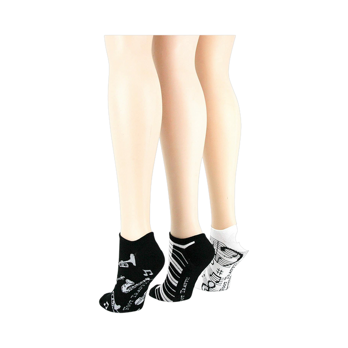 Lifestyle shot: different angle showing three pairs of musical socks on mannequin legs.