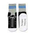 Flat lay image showing both socks, one with the sneaker design visible and the other displaying the non-skid soles.