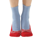 A lifestyle shot of a person wearing the red and light blue non-skid slipper socks.
