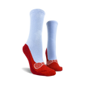 Pair of red and light blue non-skid slipper socks.  The bottom features red slipper design with a bow and non-skid grips.
