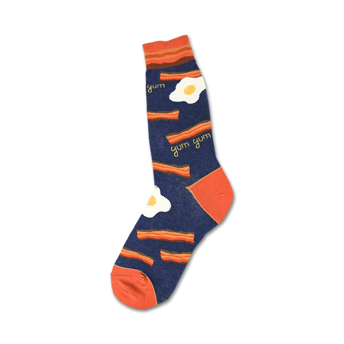 orange bacon strips and sunny side up eggs pattern on blue mens crew socks.    }}