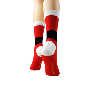 A pair of red socks with white trim at the top and a black band with a yellow buckle design. The socks have a white sole and the words 