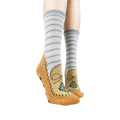 Lifestyle shot showing the moccasin slipper socks on a person's feet. Grey and tan colors are displayed.