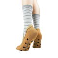 Back view of the socks highlighting the non-skid grips and the tan moccasin design.