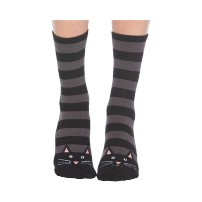 A pair of gray and black striped crew socks with cute black cat faces at the toes. Non-skid bottom.
