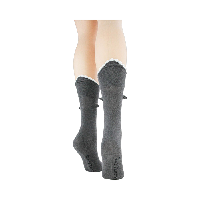 Back view of grey Shark Bite 3D socks on a mannequin leg, showcasing the scalloped cuff.